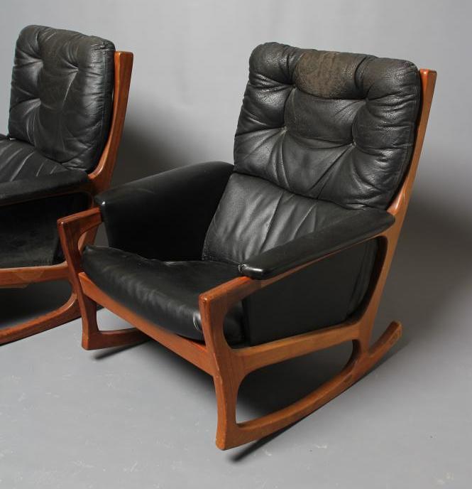 A PAIR OF FORMOSA TEAK AND LEATHERETTE FRAMED ROCKING ARMCHAIRS Image