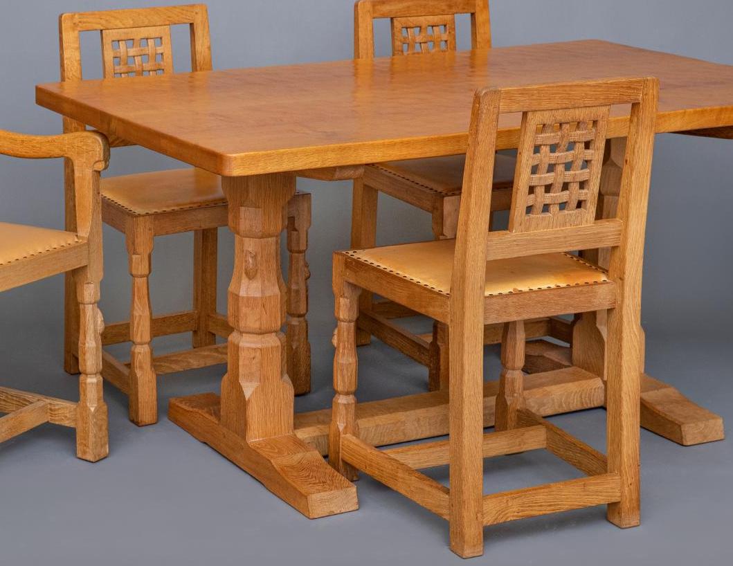 A ROBERT THOMPSON ADZED OAK REFECTORY TABLE of rounded oblong form Image