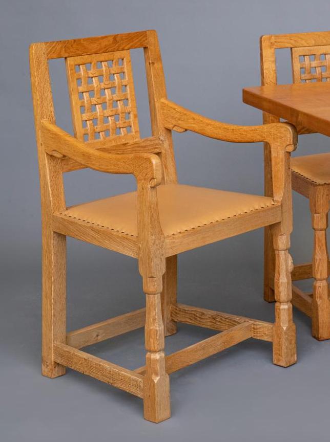 A SET OF EIGHT ROBERT THOMPSON OAK DINING CHAIRS Image