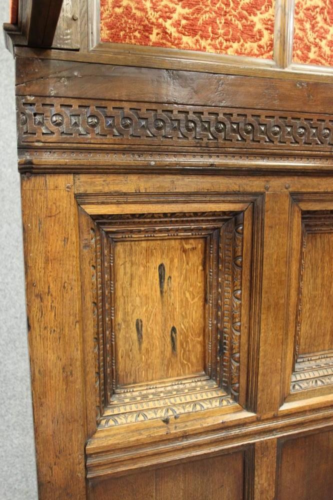 A CARVED AND JOINED OAK CANOPY BEDSTEAD Image