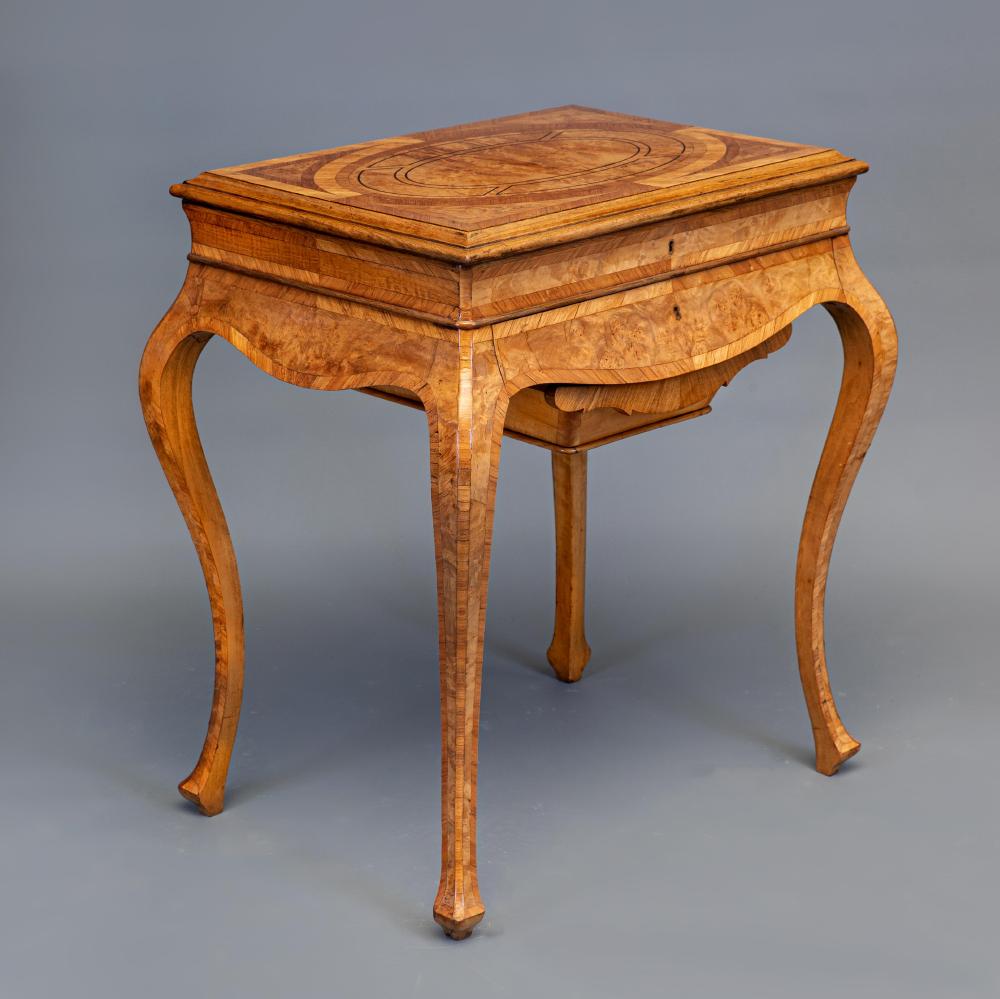 A FRENCH BURR WALNUT AND MAHOGANY BANDED WORK TABLE Image