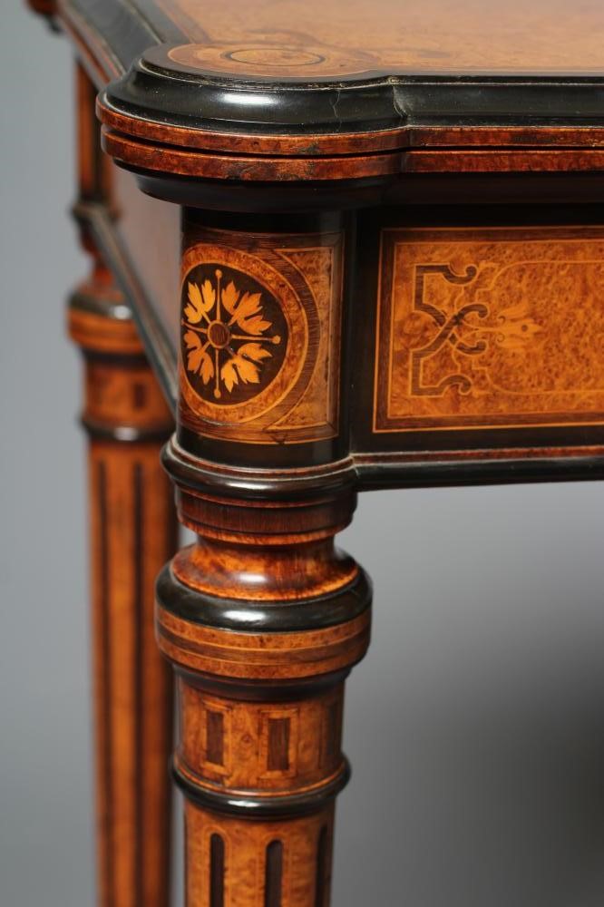 A FINE QUALITY AMBOYNA FOLDING CARD TABLE in the manner of Jackson & Graham Image