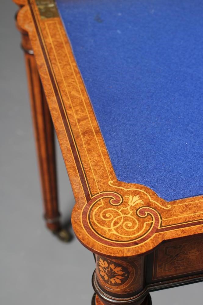 A FINE QUALITY AMBOYNA FOLDING CARD TABLE in the manner of Jackson & Graham Image