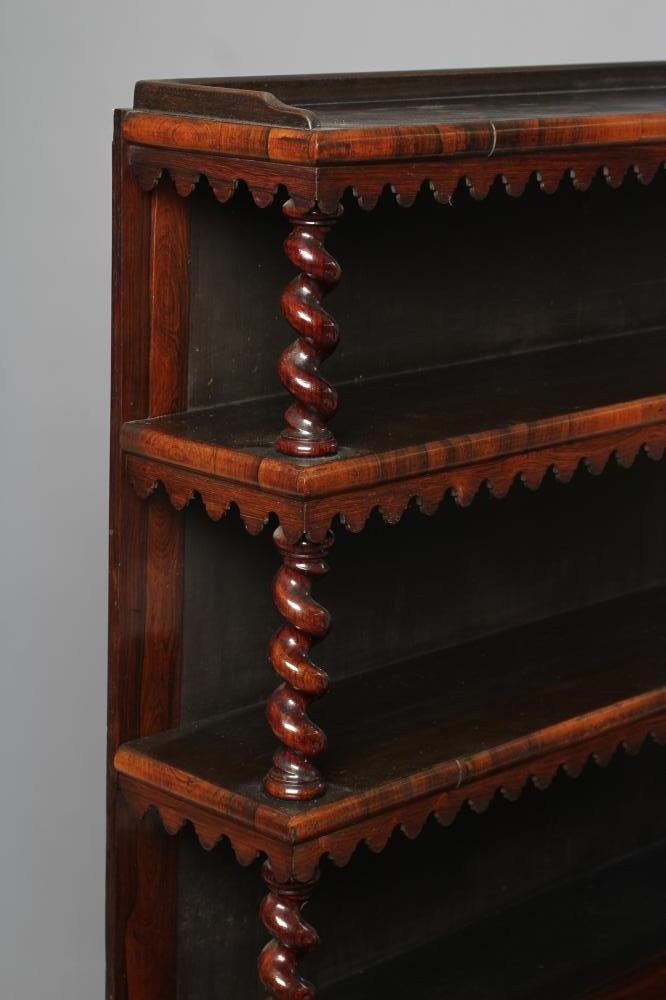 A VICTORIAN ROSEWOOD OPEN BOOKCASE of oblong graduated form with spiral twist and baluster turned Image