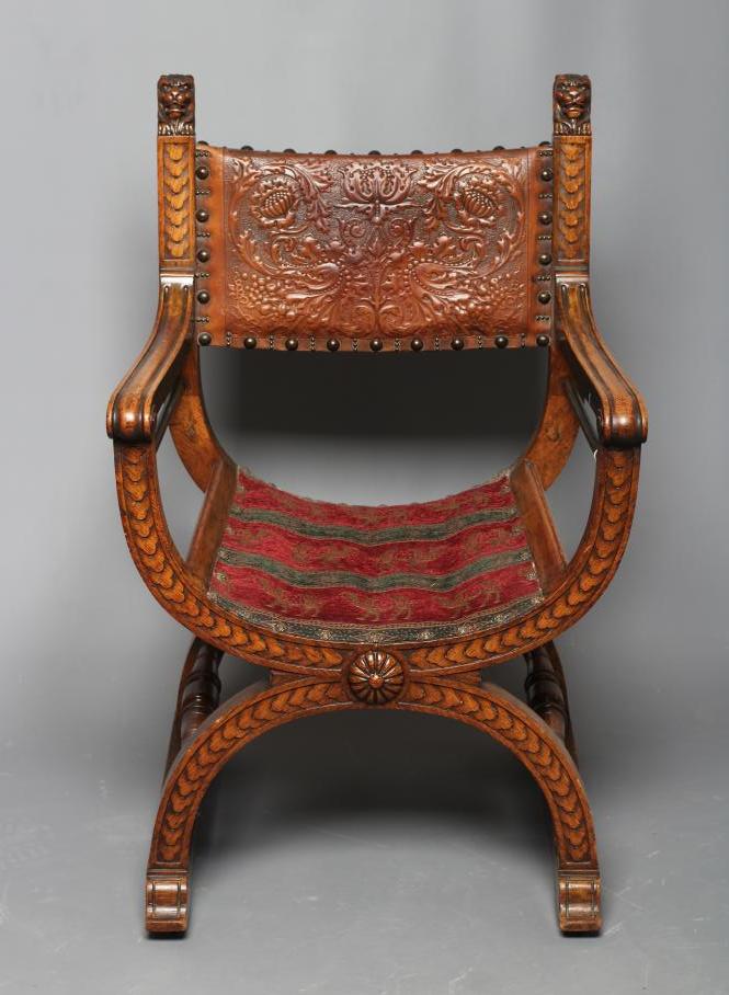 A SPANISH OAK X FRAMED ARMCHAIR Image