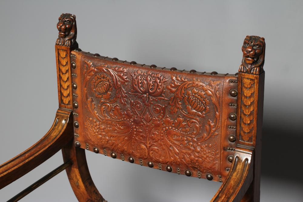 A SPANISH OAK X FRAMED ARMCHAIR Image