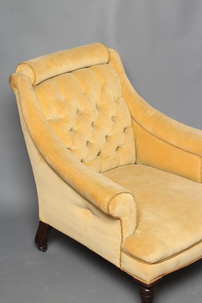 A VICTORIAN WALNUT FRAMED ARMCHAIR upholstered in yellow dralon Image