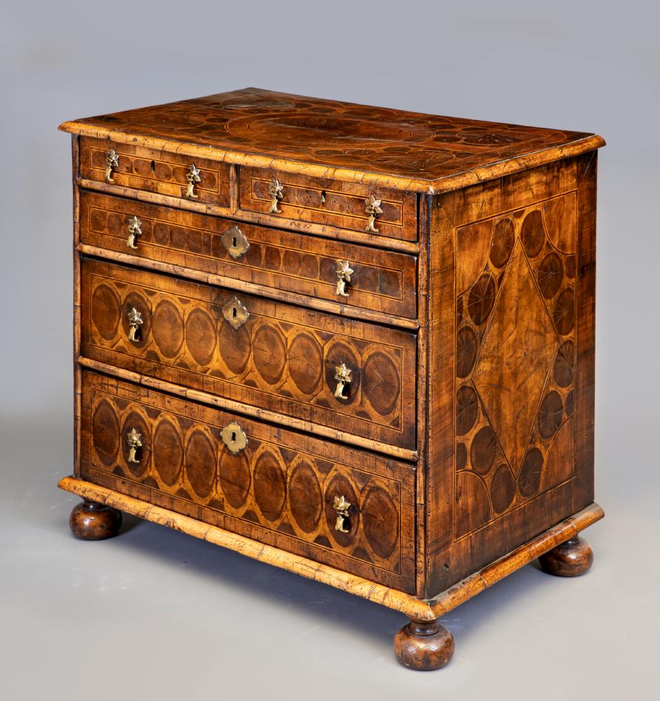 A WILLIAM & MARY STYLE WALNUT AND LABURNUM OYSTER VENEERED CHEST Image