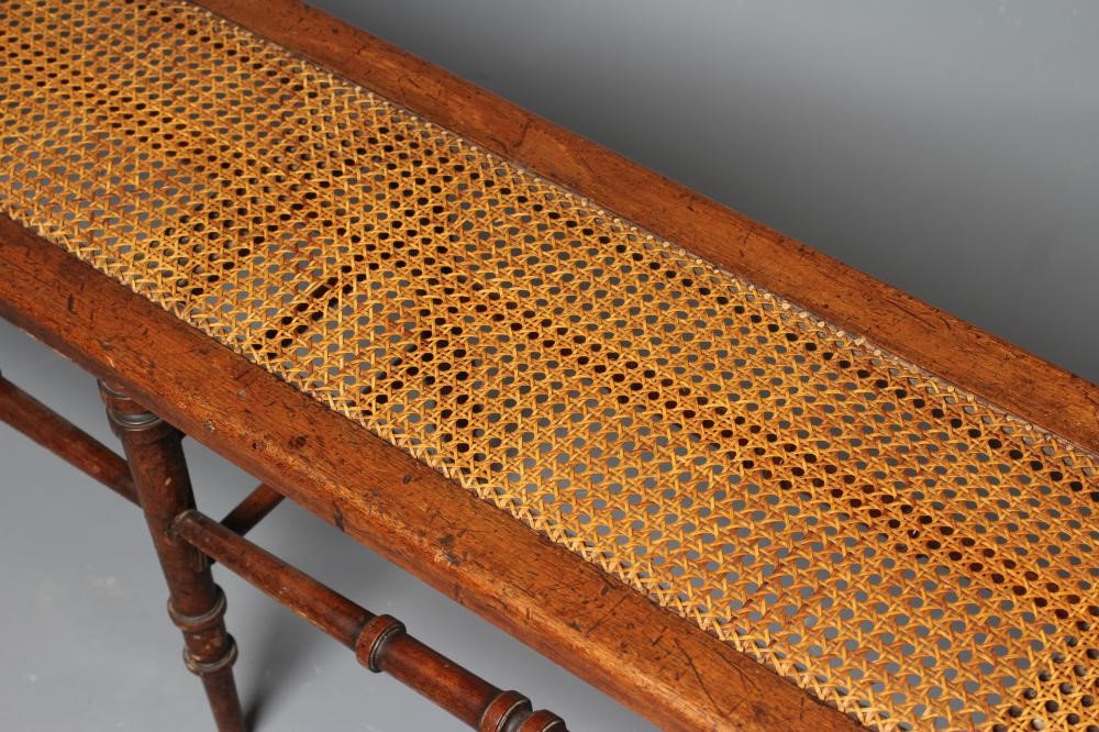 A VICTORIAN WALNUT(?) BENCH of rounded oblong form with caned seat Image