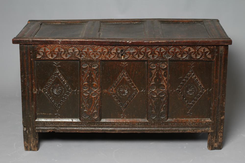 AN OAK PANELLED COFFER Image