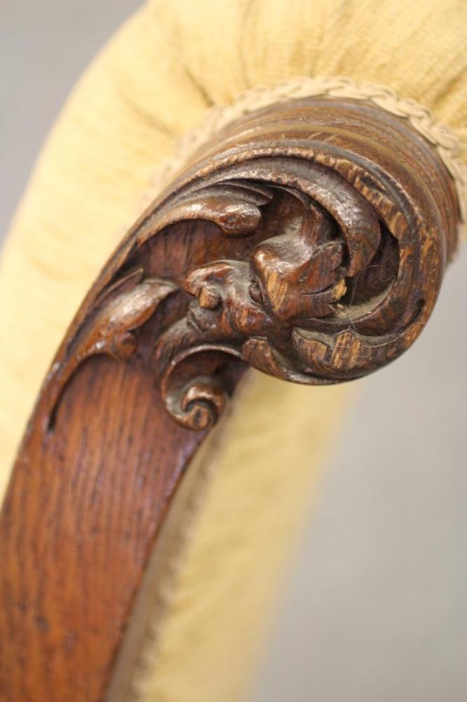 A GENTLEMAN'S VICTORIAN OAK FRAMED ARMCHAIR upholstered in gold chenille Image