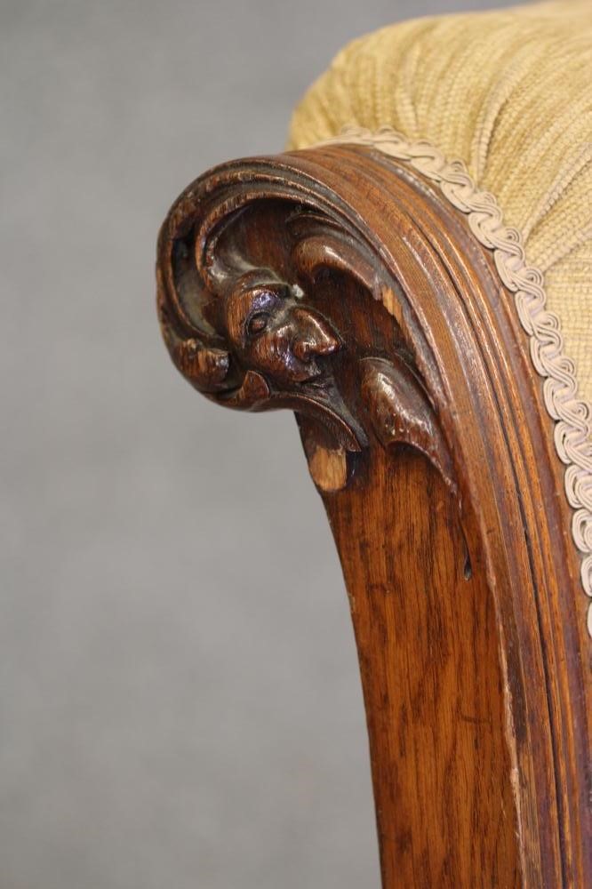 A GENTLEMAN'S VICTORIAN OAK FRAMED ARMCHAIR upholstered in gold chenille Image
