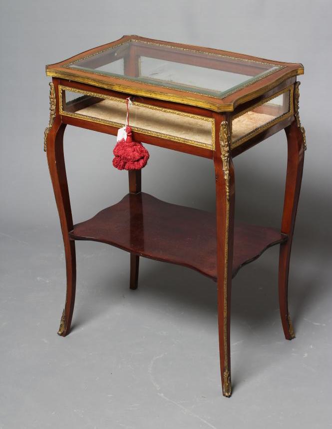 A VICTORIAN MAHOGANY AND GILT METAL MOUNTED BIJOUTERIE TABLE Image