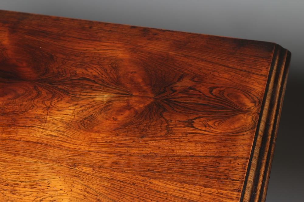 AN EARLY VICTORIAN ROSEWOOD FOLDING CARD TABLE of rounded oblong form Image