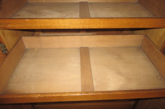 A GOTHIC REVIVAL LIGHT OAK AND BLACK STENCILLED WARDROBE Image