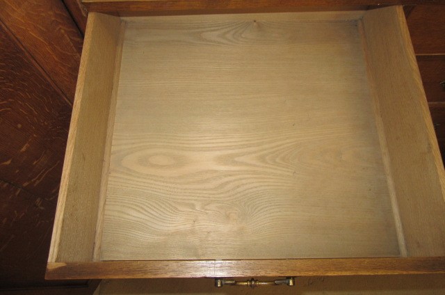 A GOTHIC REVIVAL LIGHT OAK AND BLACK STENCILLED WARDROBE Image