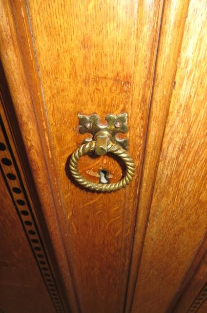 A GOTHIC REVIVAL LIGHT OAK AND BLACK STENCILLED WARDROBE Image