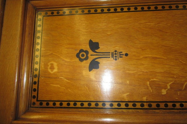 A GOTHIC REVIVAL LIGHT OAK AND BLACK STENCILLED WARDROBE Image