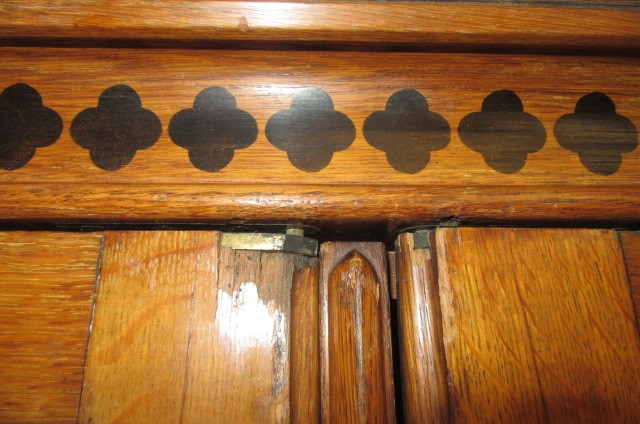 A GOTHIC REVIVAL LIGHT OAK AND BLACK STENCILLED WARDROBE Image
