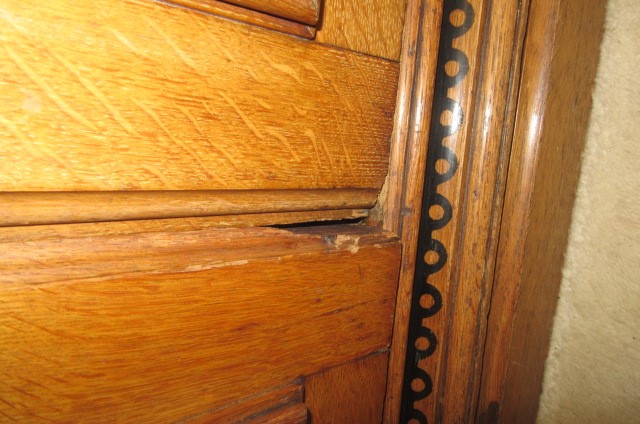 A GOTHIC REVIVAL LIGHT OAK AND BLACK STENCILLED WARDROBE Image