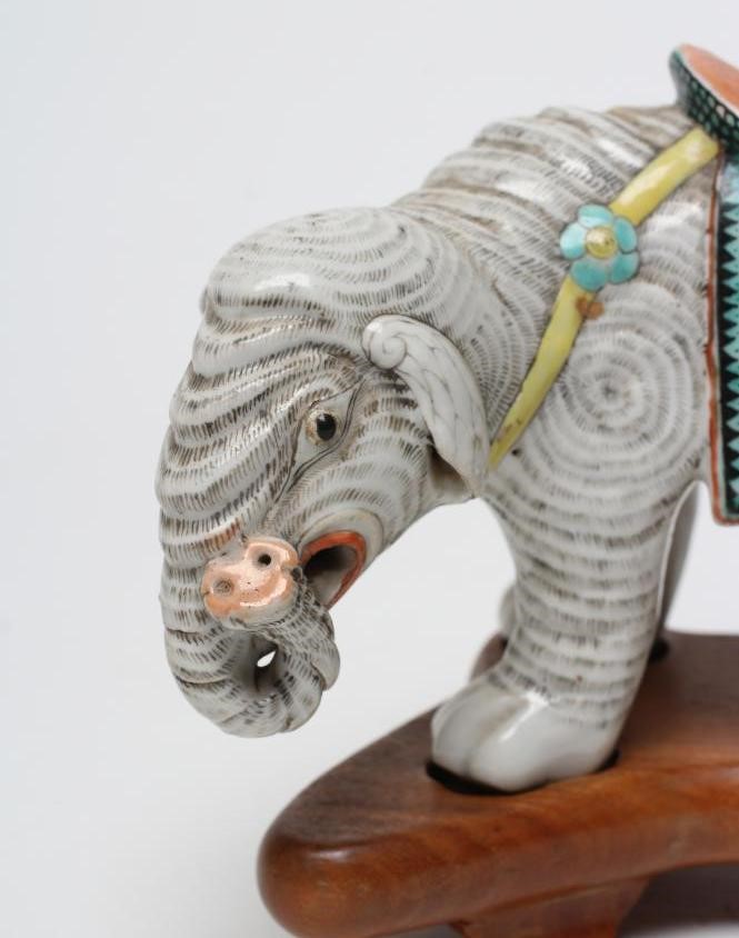 A CHINESE PORCELAIN JOSS STICK HOLDER/INCENSE BURNER modelled as an elephant with orange Image