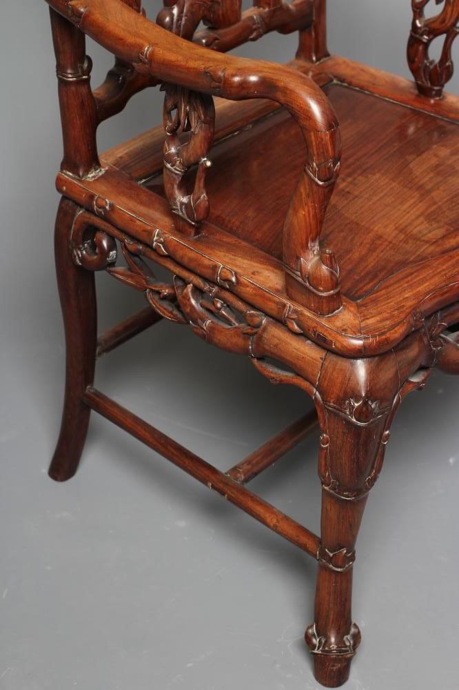 A CHINESE HARD WOOD ARMCHAIR carved throughout with bamboo Image
