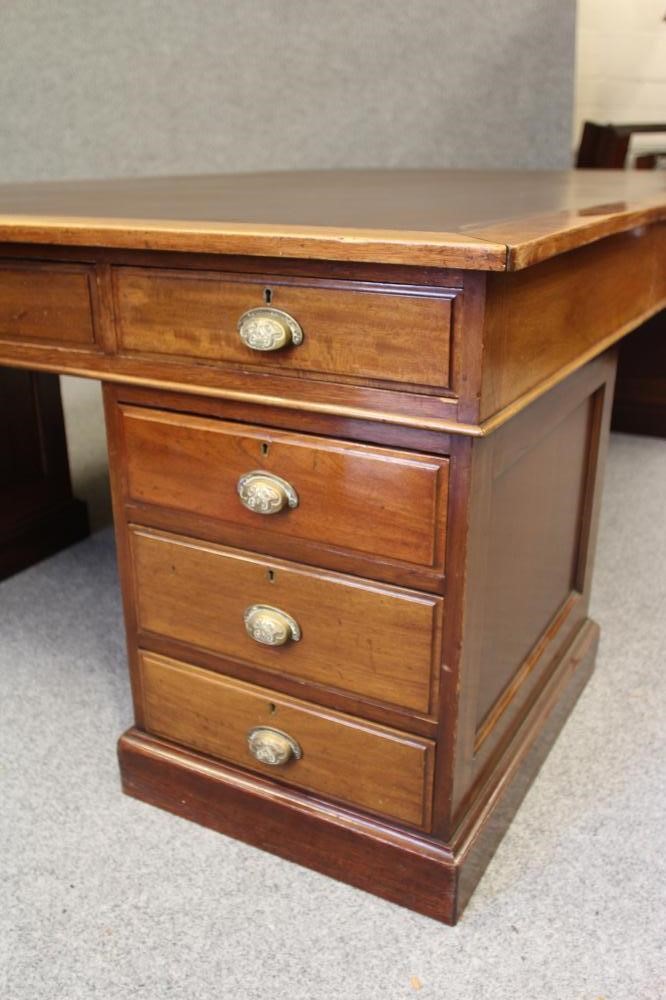 A LARGE MAHOGANY LIBRARY DESK Image