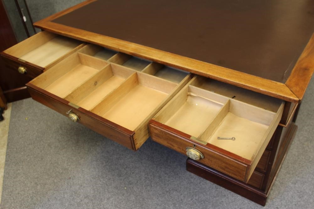 A LARGE MAHOGANY LIBRARY DESK Image