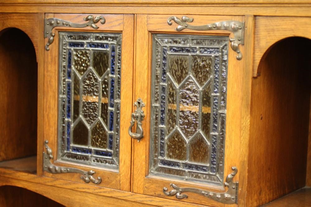 A GENTLEMAN'S ARTS AND CRAFTS STYLE OAK WARDROBE Image