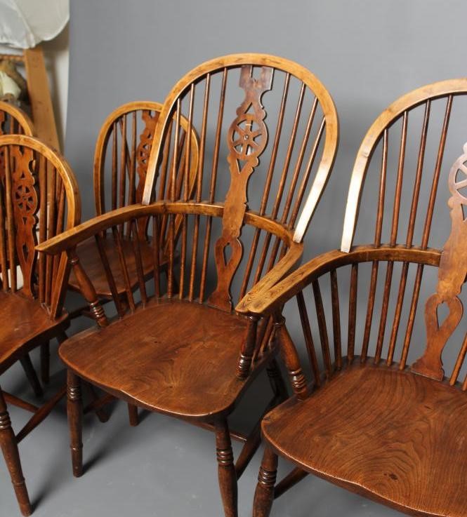 A SET OF SIX WHEELBACK WINDSOR CHAIRS Image