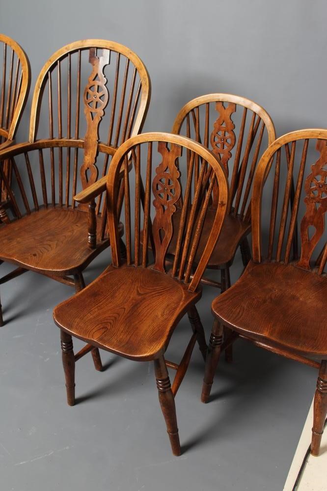 A SET OF SIX WHEELBACK WINDSOR CHAIRS Image