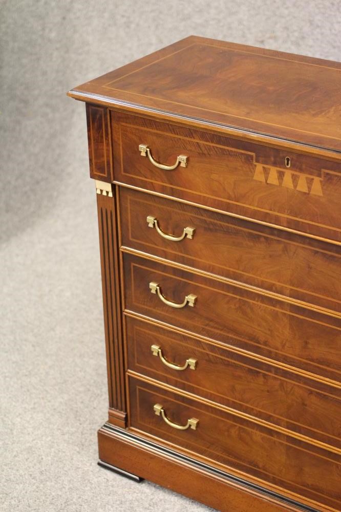 A WALNUT AND EBONISED SECRETAIRE CHEST Image