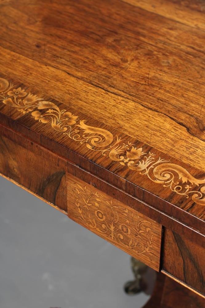 A REGENCY ROSEWOOD FOLDING TEA TABLE of rounded oblong form Image