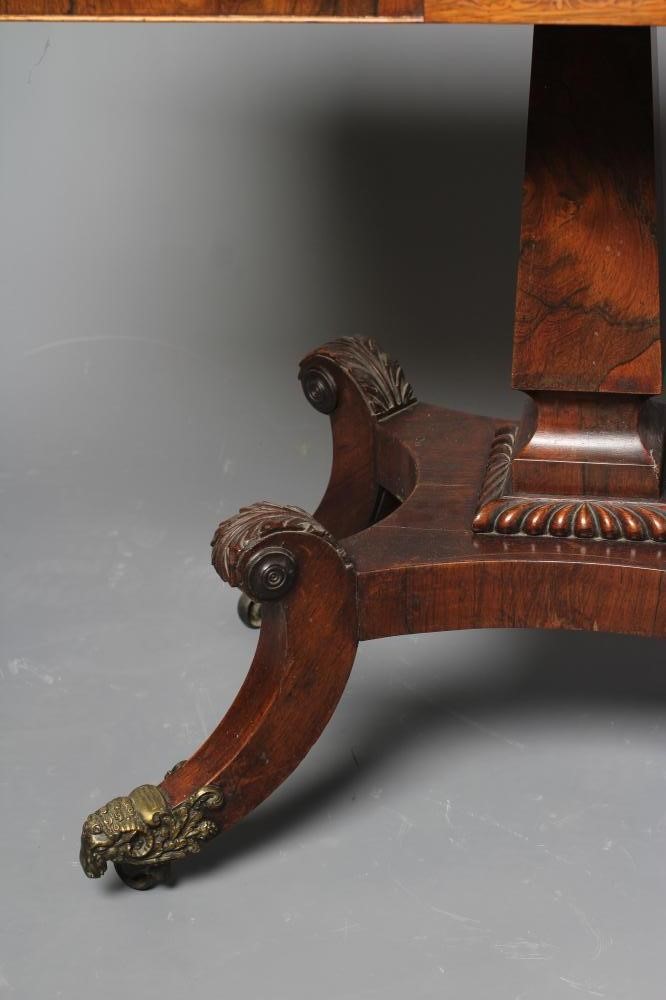 A REGENCY ROSEWOOD FOLDING TEA TABLE of rounded oblong form Image