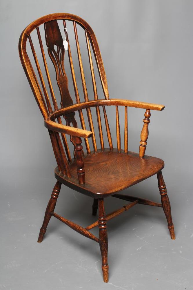 A  WINDSOR SPINDLE BACK ARMCHAIR in ash and elm Image