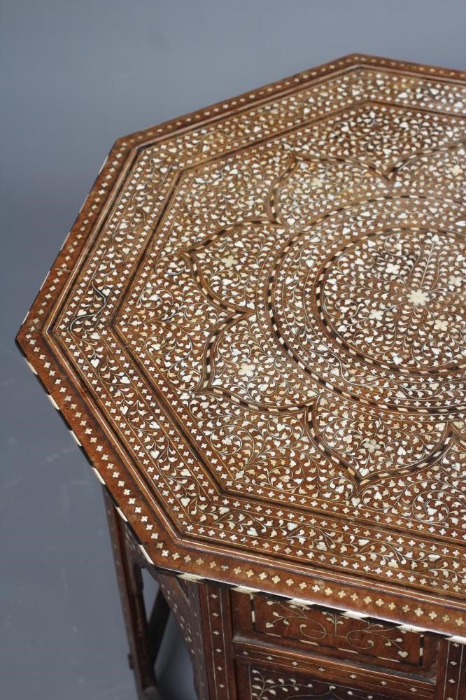 AN INDIAN HARDWOOD OCCASIONAL TABLE Image