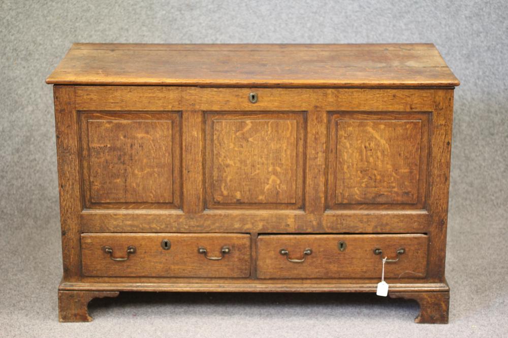 AN OAK PANELLED CHEST Image