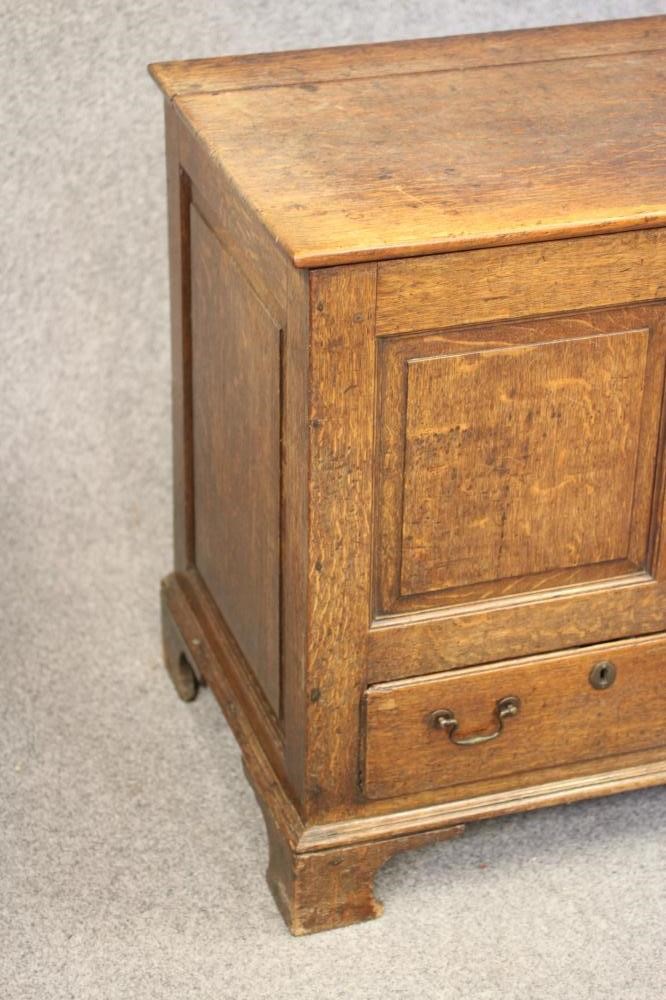 AN OAK PANELLED CHEST Image