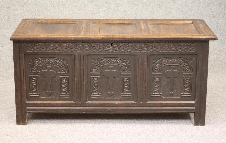 AN OAK PANELLED COFFER Image