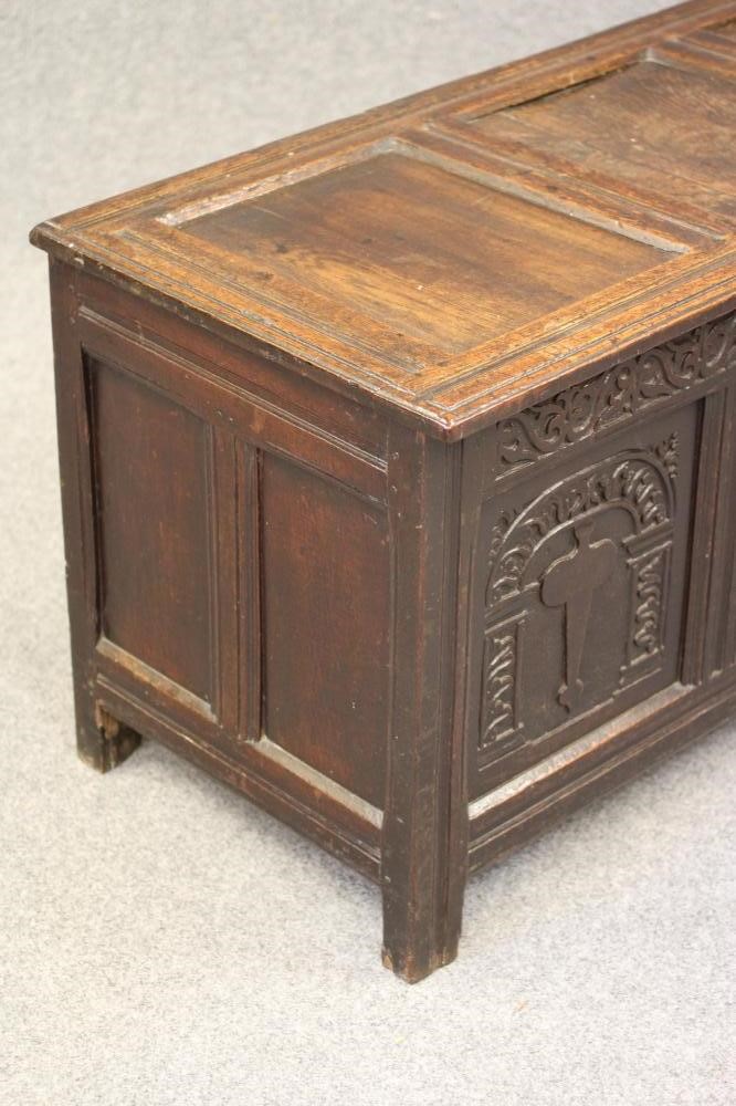 AN OAK PANELLED COFFER Image