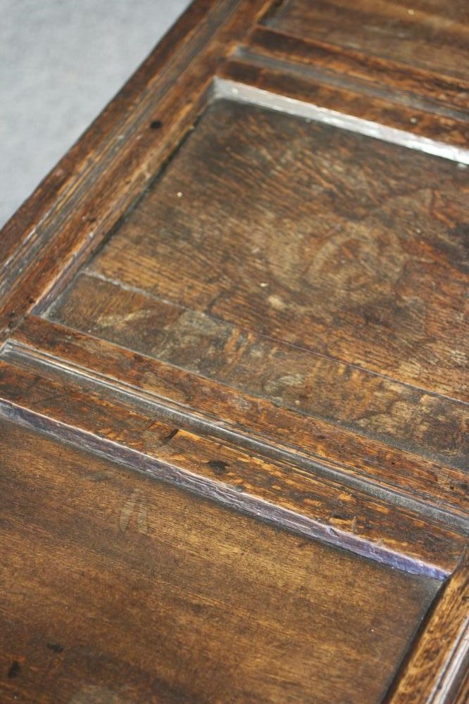 AN OAK PANELLED COFFER Image