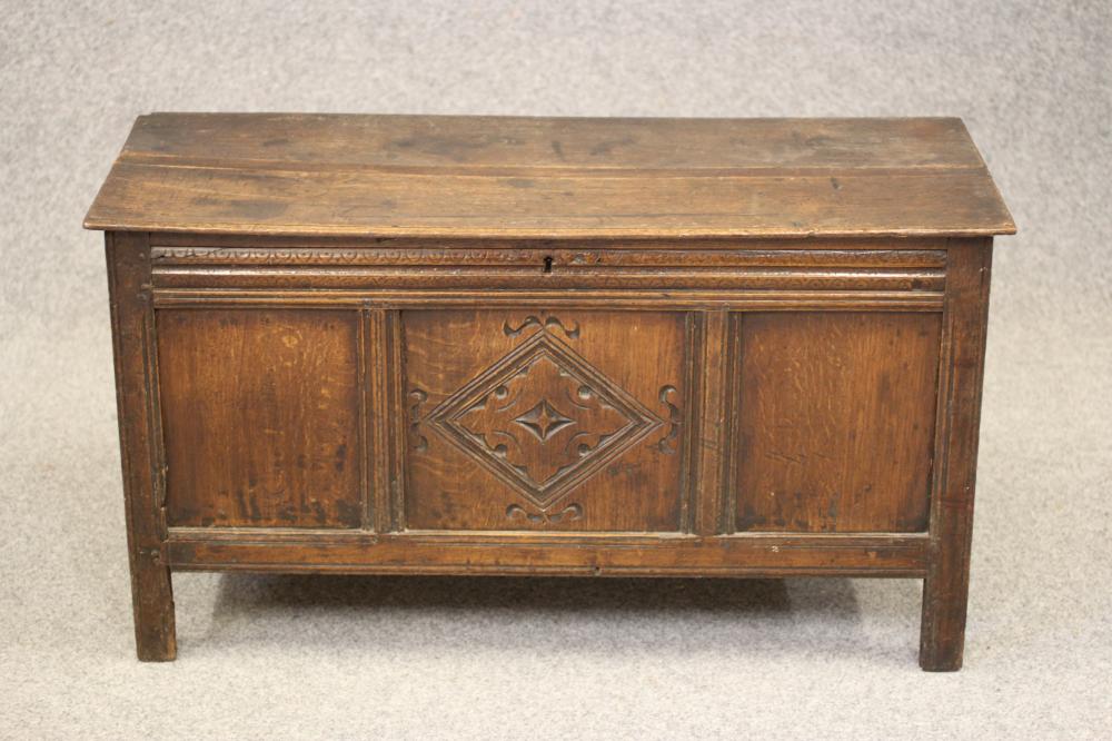 AN OAK PANELLED COFFER Image