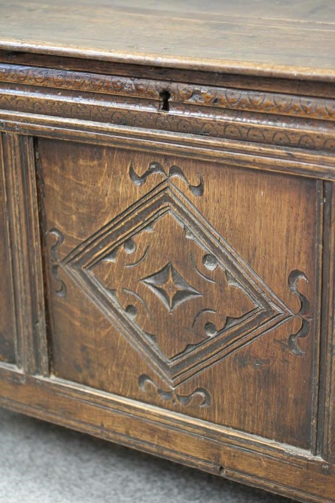 AN OAK PANELLED COFFER Image