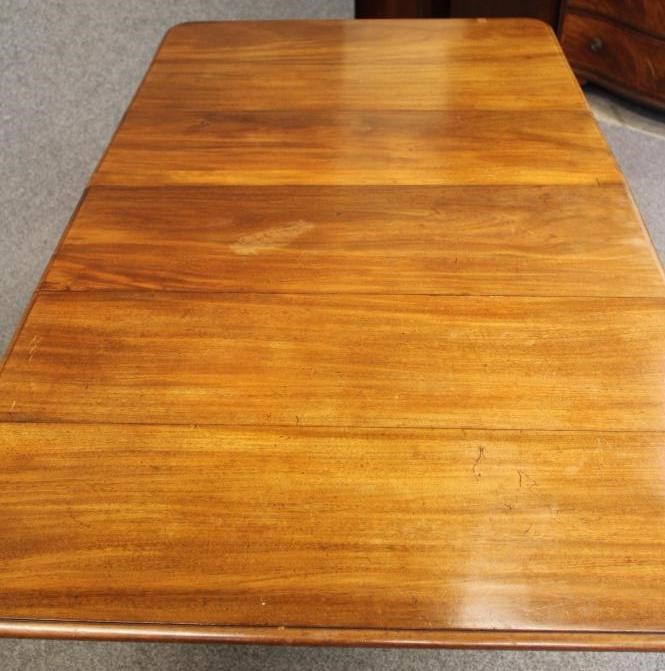 A MAHOGANY BREAKFAST TABLE Image