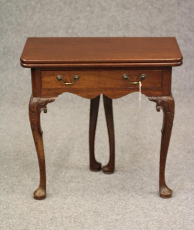 A GEORGIAN MAHOGANY FOLDING TEA TABLE Image