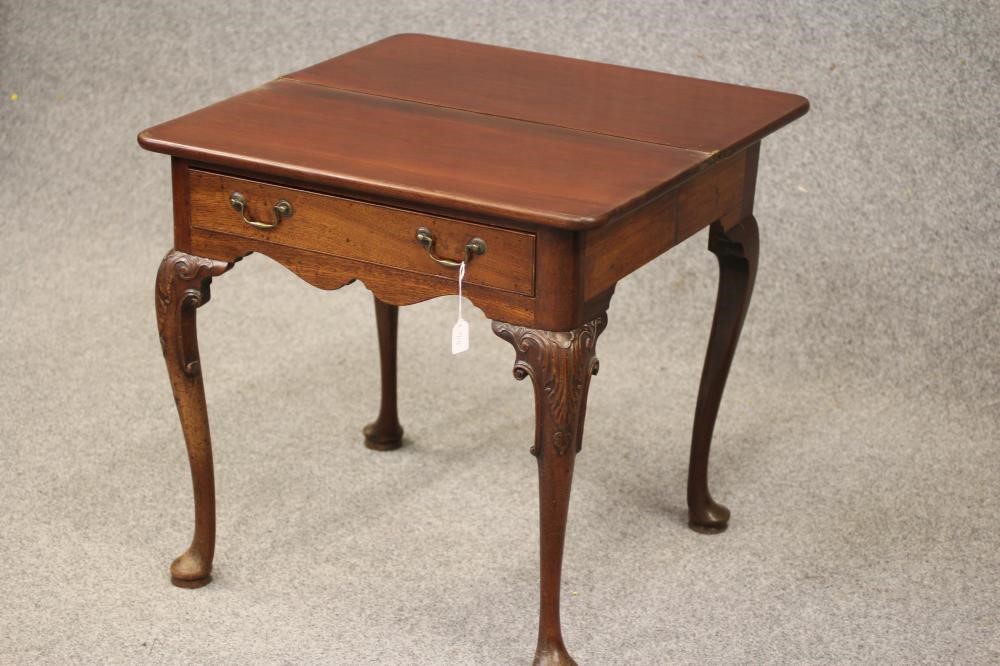 A GEORGIAN MAHOGANY FOLDING TEA TABLE Image