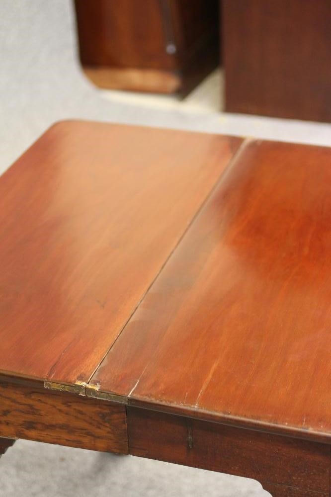 A GEORGIAN MAHOGANY FOLDING TEA TABLE Image