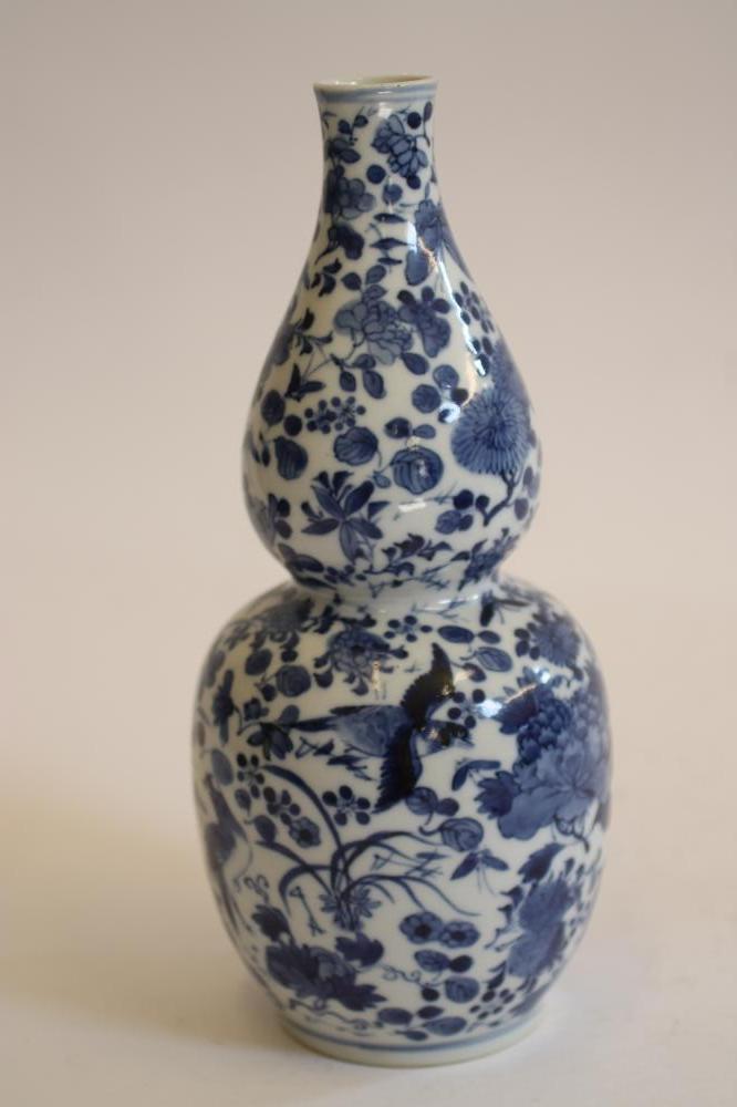 A CHINESE PORCELAIN VASE of slender double gourd form Image