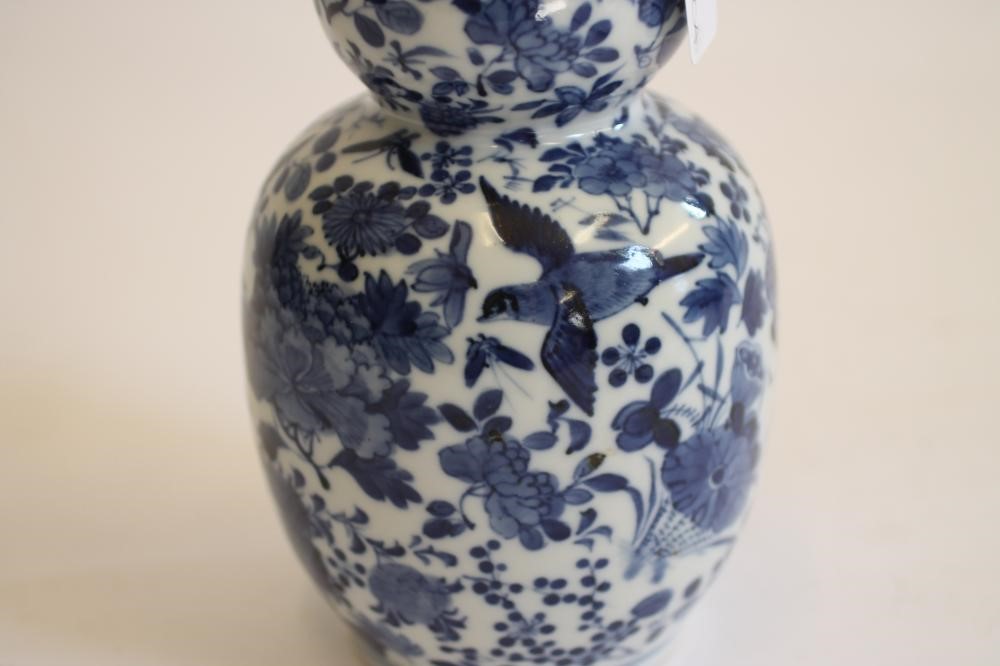 A CHINESE PORCELAIN VASE of slender double gourd form Image