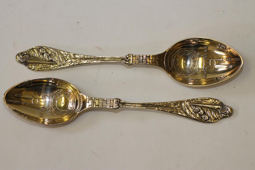 A PAIR OF GILDED SILVER  "BIRTH RECORD" SPOONS Image